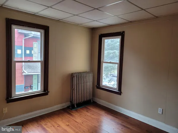 a view of an front door and wooden floor