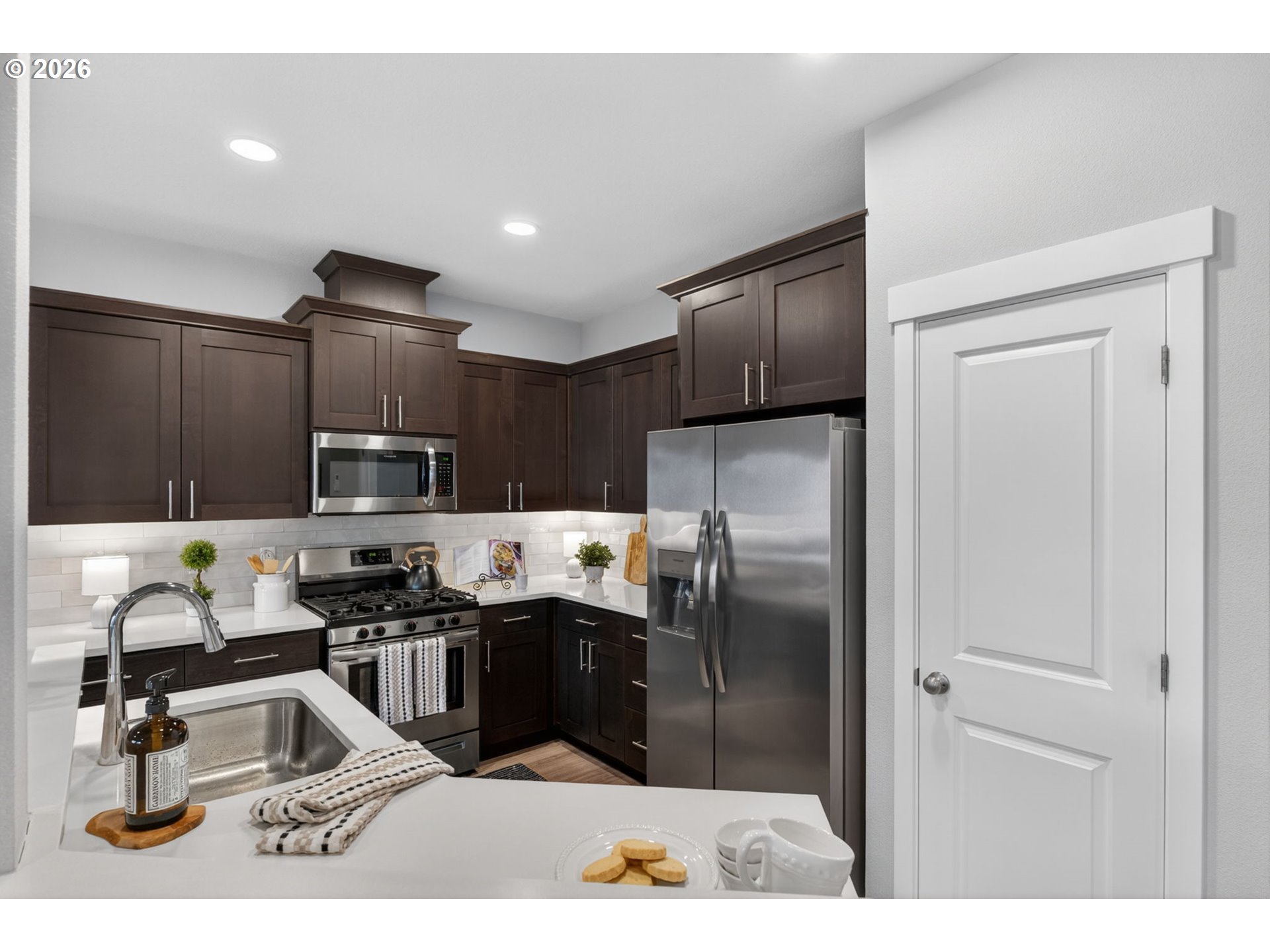 2876 South Nectarine Street Cornelius, OR 97113 - Photo 11 of 42 a kitchen with kitchen island a counter top space appliances and cabinets