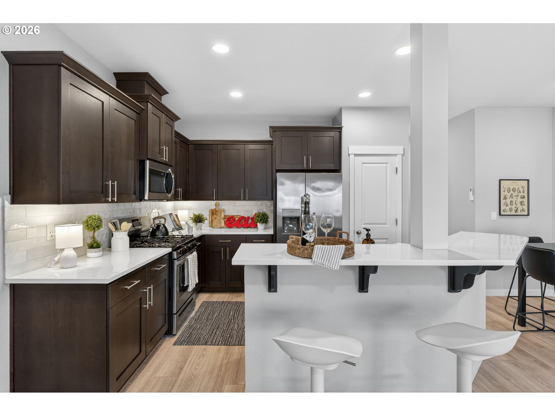 2876 South Nectarine Street Cornelius, OR 97113 - Photo 12 of 42 a kitchen with counter top space a sink cabinets and appliances