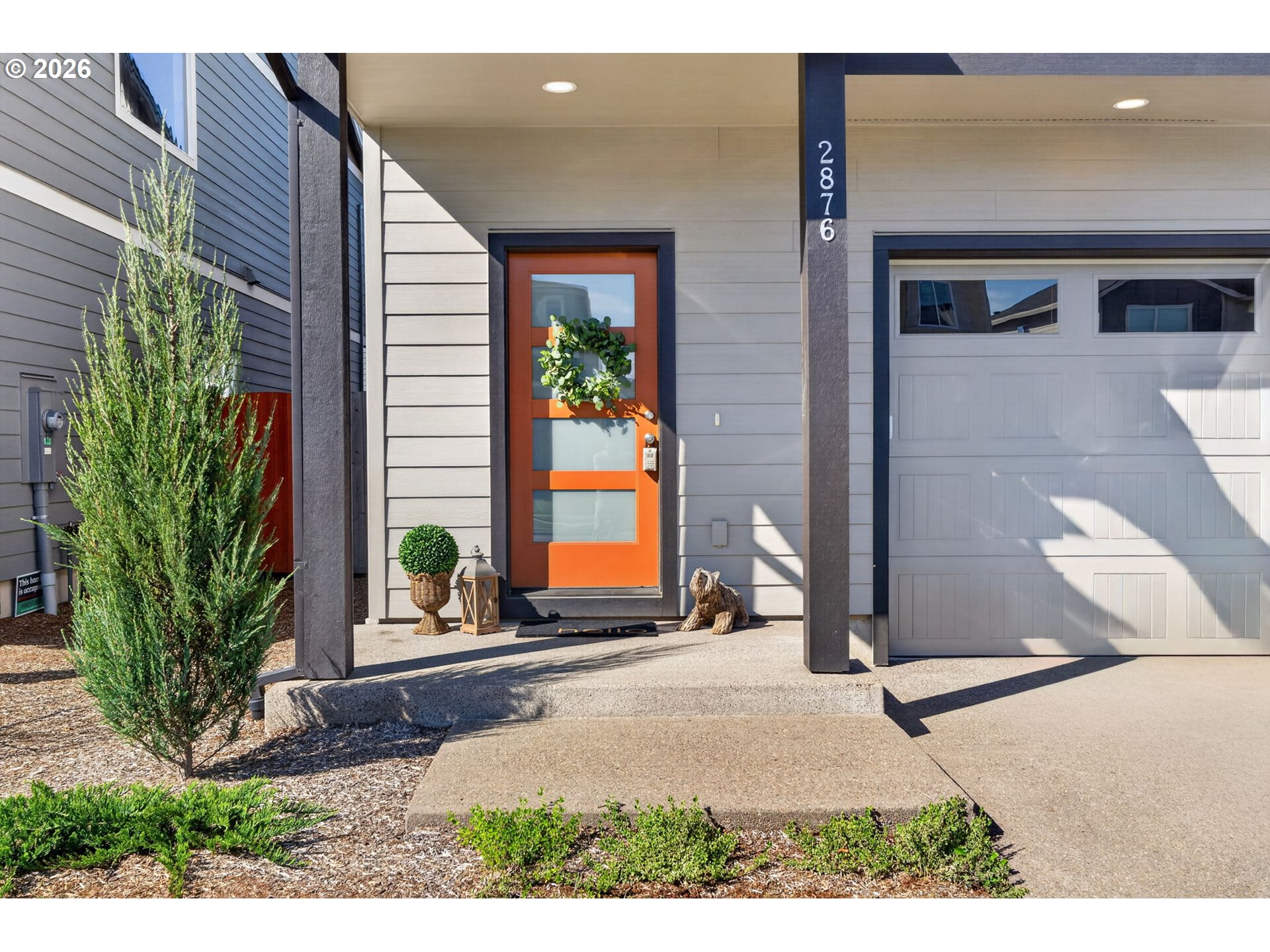 2876 South Nectarine Street Cornelius, OR 97113 - Photo 2 of 42 a front view of a house with a yard