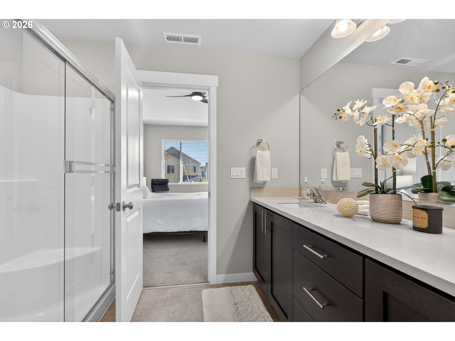 2876 South Nectarine Street Cornelius, OR 97113 - Photo 24 of 42 a en suite bathroom with a double vanity sink a mirror and shower