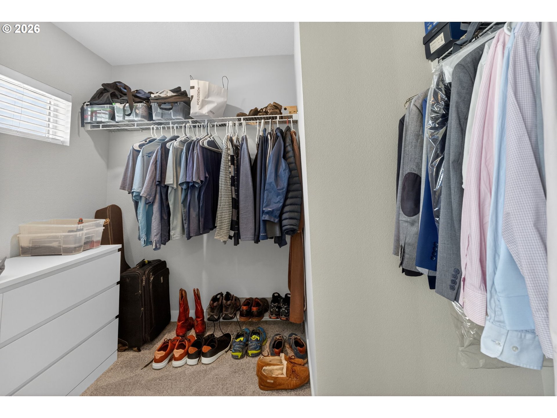 2876 South Nectarine Street Cornelius, OR 97113 - Photo 26 of 42 a view of walk in closet with clothes and shoes
