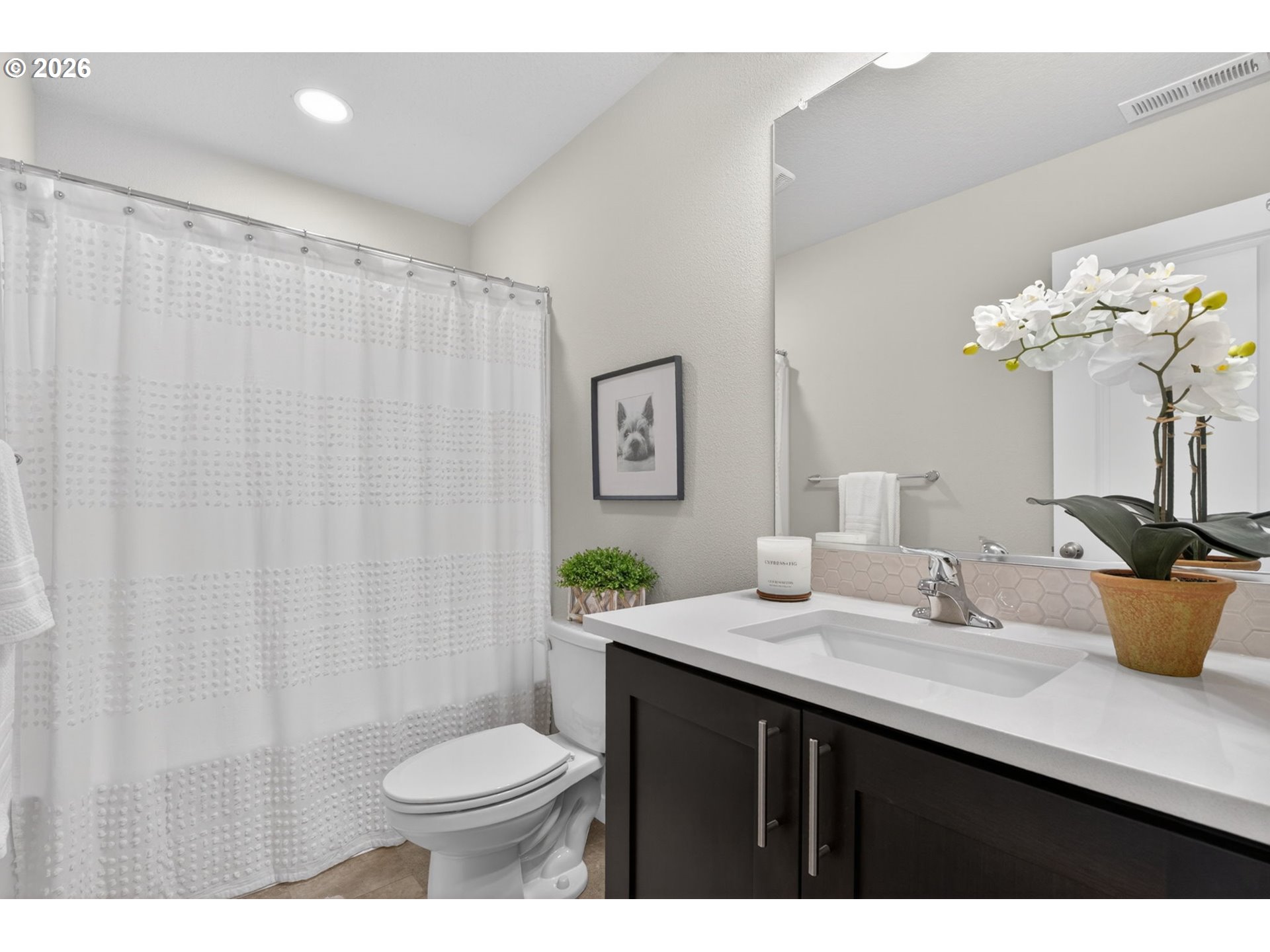2876 South Nectarine Street Cornelius, OR 97113 - Photo 31 of 42 a bathroom with a sink a toilet and shower curtain