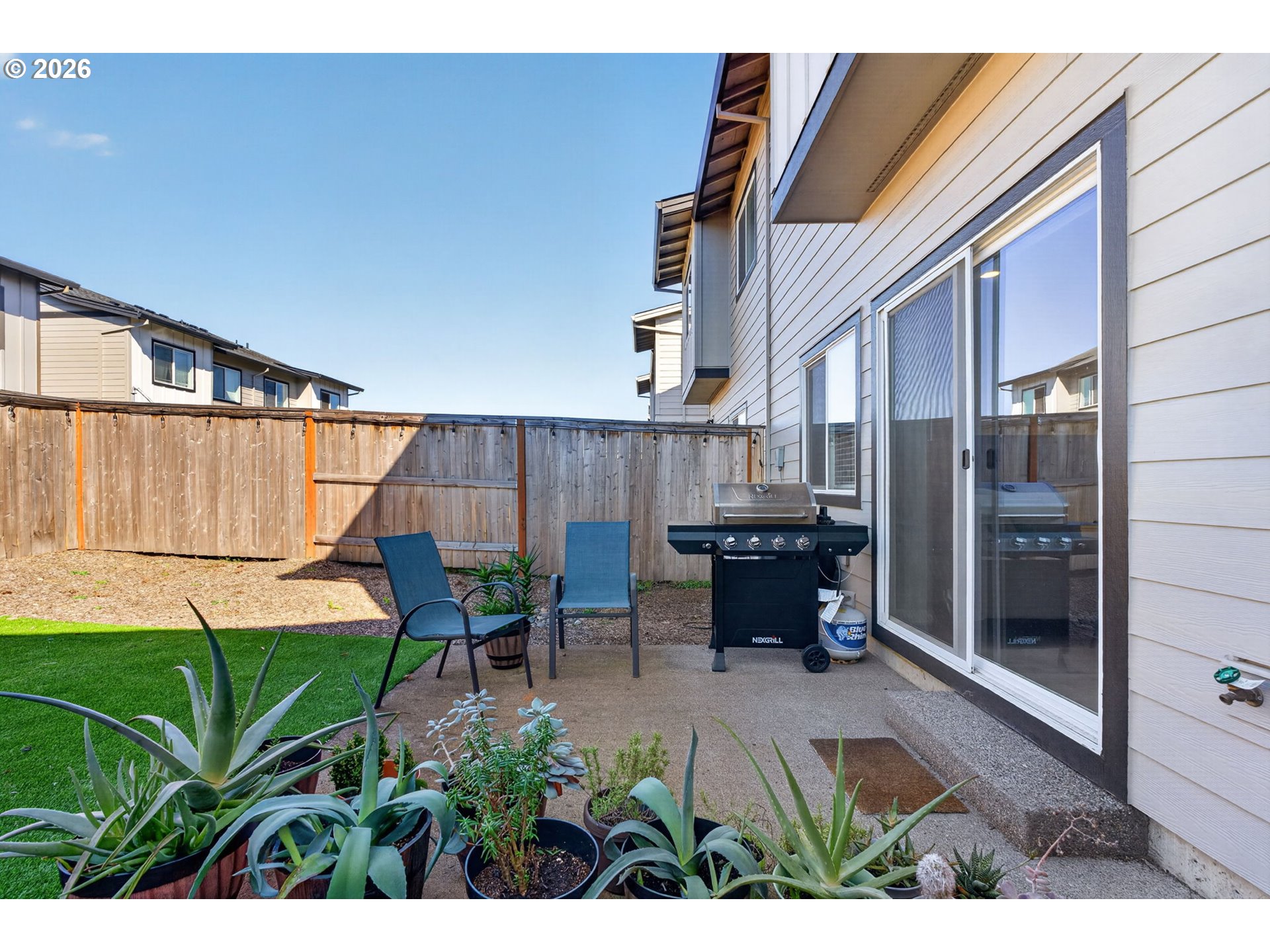 2876 South Nectarine Street Cornelius, OR 97113 - Photo 33 of 42 a view of a patio with table and chairs and potted plants