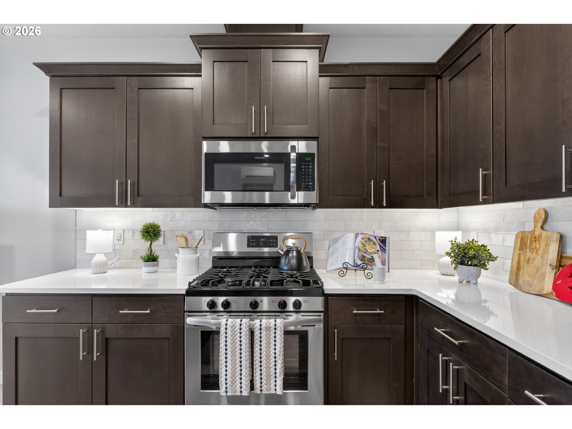 2876 South Nectarine Street Cornelius, OR 97113 - Photo 8 of 42 a kitchen with a sink a stove and cabinets