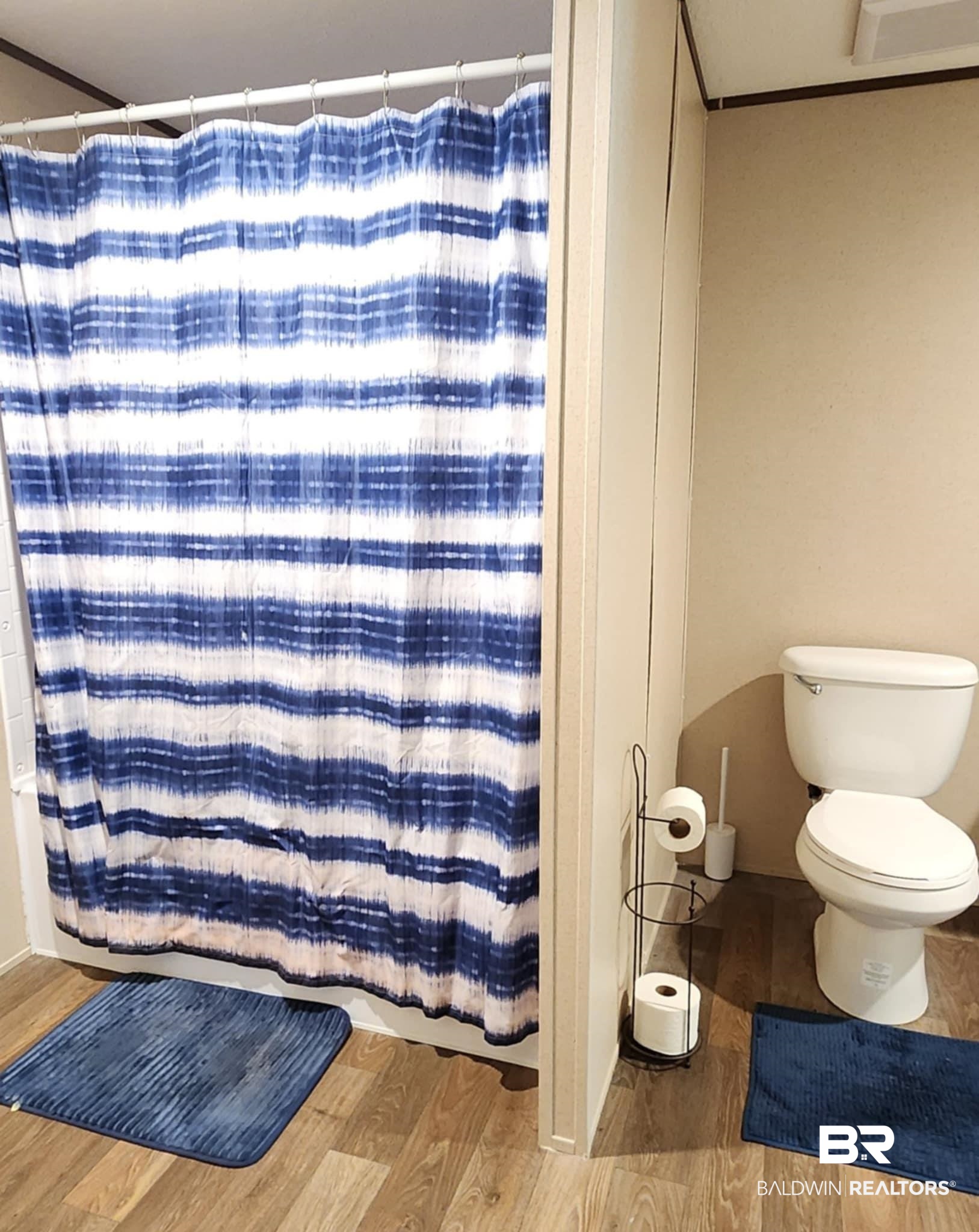 25474 Waterworld Road Robertsdale, AL 36567 - Photo 21 of 30 Bathroom with light wood finished floors and toilet