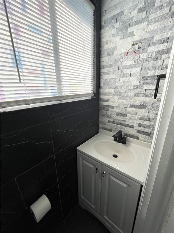 3428 Ithaca Street North St. Petersburg, FL 33713 - Photo 15 of 22 a bathroom with a sink a toilet and a window