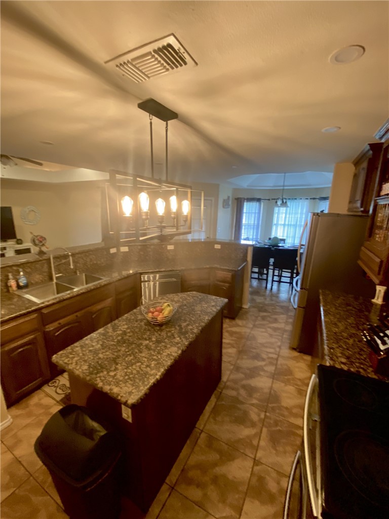 1250 Lawrence Trail Alice, TX 78332 - Photo 11 of 40 a view of a living room and kitchen