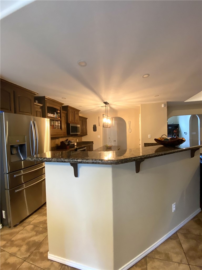 1250 Lawrence Trail Alice, TX 78332 - Photo 15 of 40 a kitchen with stainless steel appliances a refrigerator and a stove