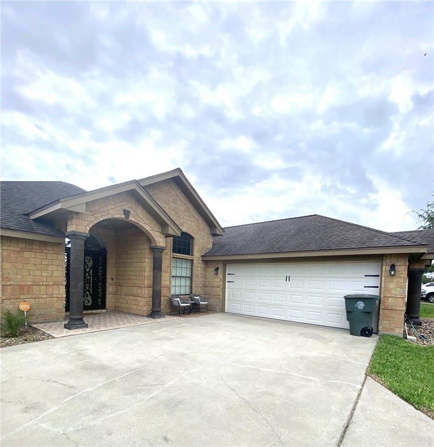 1250 Lawrence Trail Alice, TX 78332 - Photo 3 of 40 a front view of a house with a garage