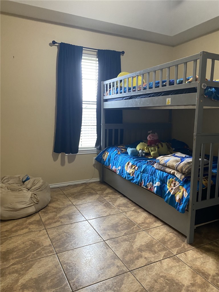 1250 Lawrence Trail Alice, TX 78332 - Photo 32 of 40 a bed room with a bed and a couch