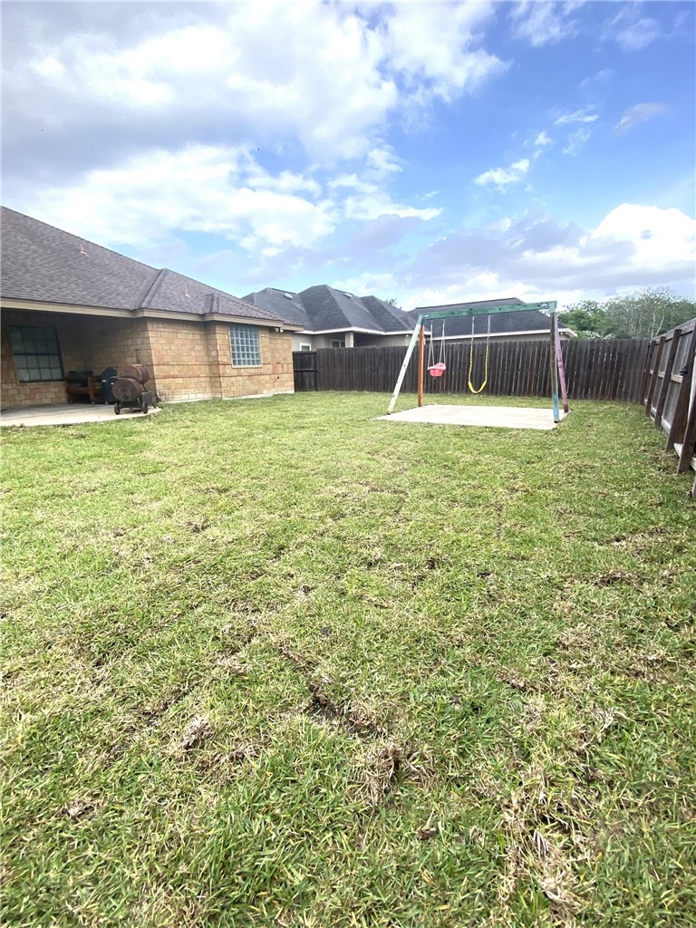 1250 Lawrence Trail Alice, TX 78332 - Photo 34 of 40 a front view of a house with a yard
