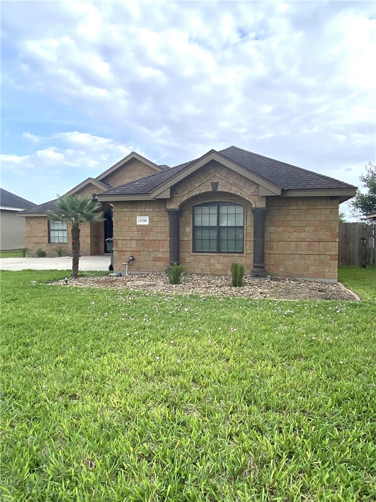 1250 Lawrence Trail Alice, TX 78332 - Photo 4 of 40 a front view of a house with a garden