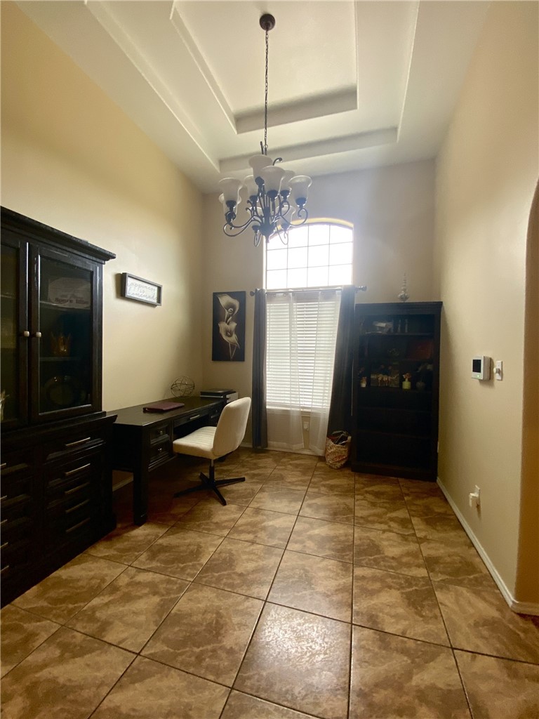 1250 Lawrence Trail Alice, TX 78332 - Photo 9 of 40 a living room with a furniture and a chandelier