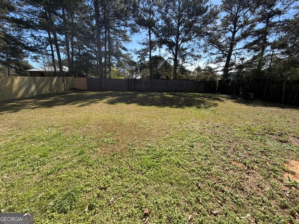 9292 Settlers Grove Road Northeast Covington, GA 30014 - Photo 106 of 110 a view of swimming pool with an outdoor space