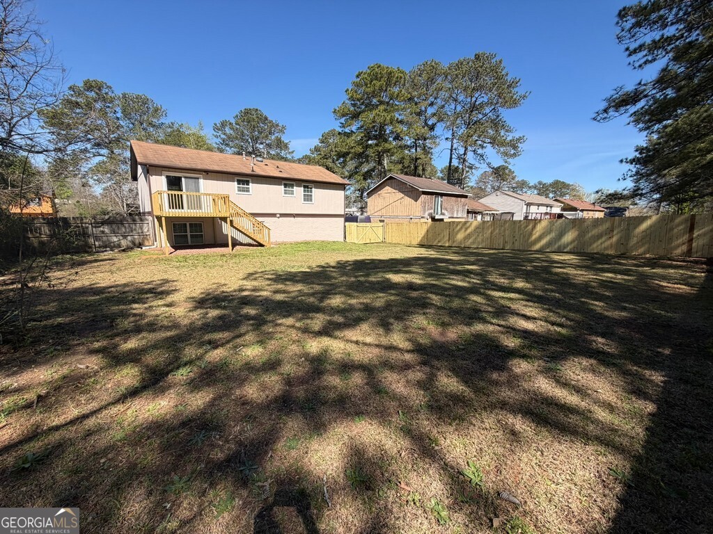 9292 Settlers Grove Road Northeast Covington, GA 30014 - Photo 110 of 110 a view of a house with a snow yard