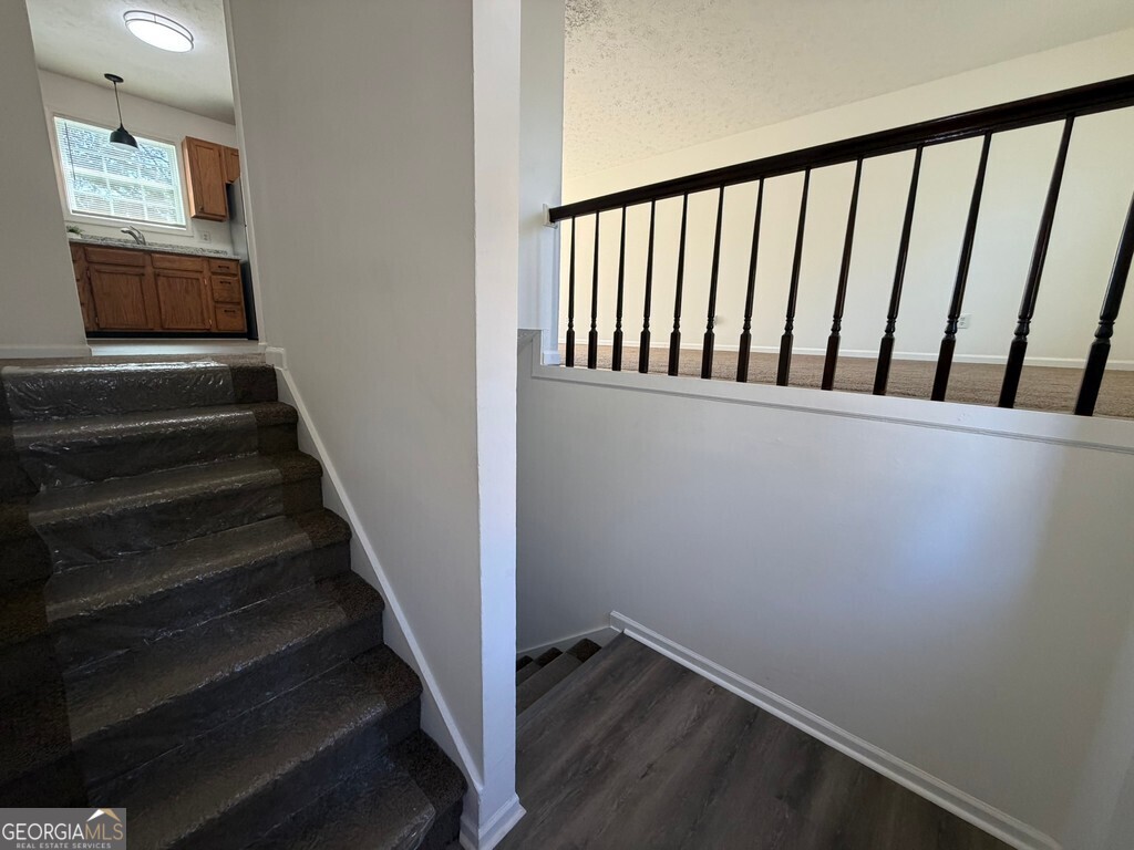 9292 Settlers Grove Road Northeast Covington, GA 30014 - Photo 11 of 110 a view of a hallway with wooden floor and entryway