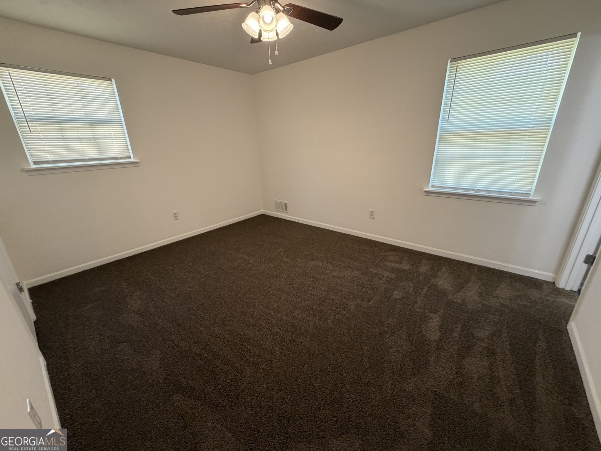 9292 Settlers Grove Road Northeast Covington, GA 30014 - Photo 29 of 110 a view of an empty room with a window