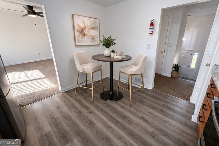 9292 Settlers Grove Road Northeast Covington, GA 30014 - Photo 30 of 110 a view of a room with furniture and wooden floor