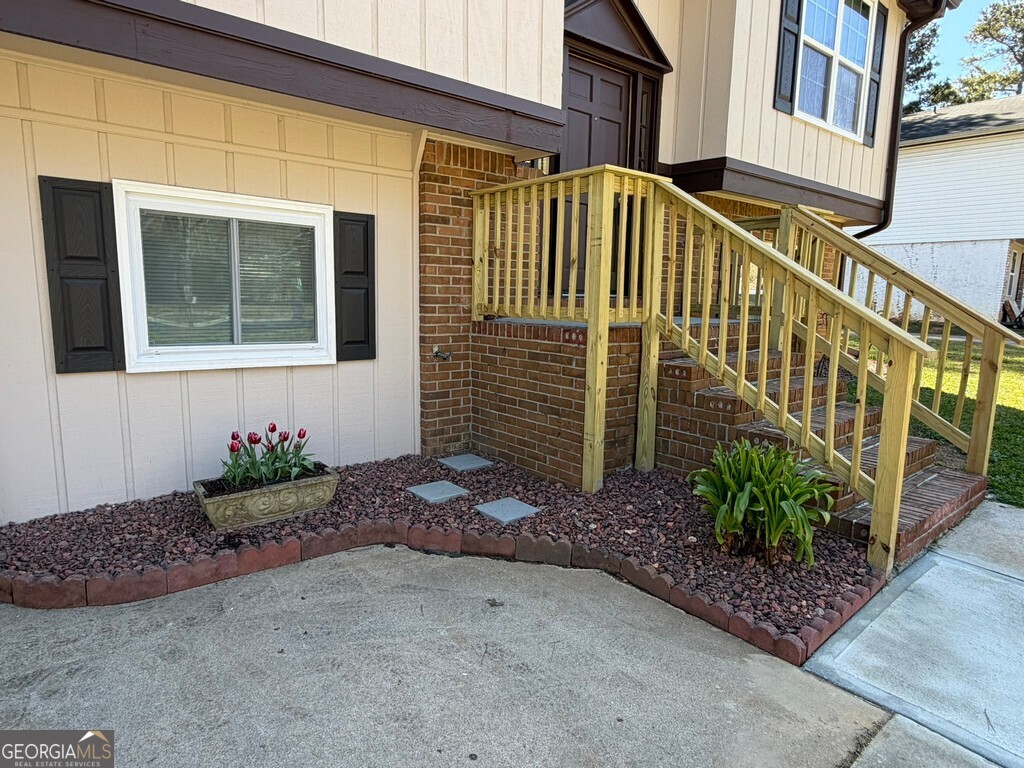 9292 Settlers Grove Road Northeast Covington, GA 30014 - Photo 3 of 110 a view of a house with a street
