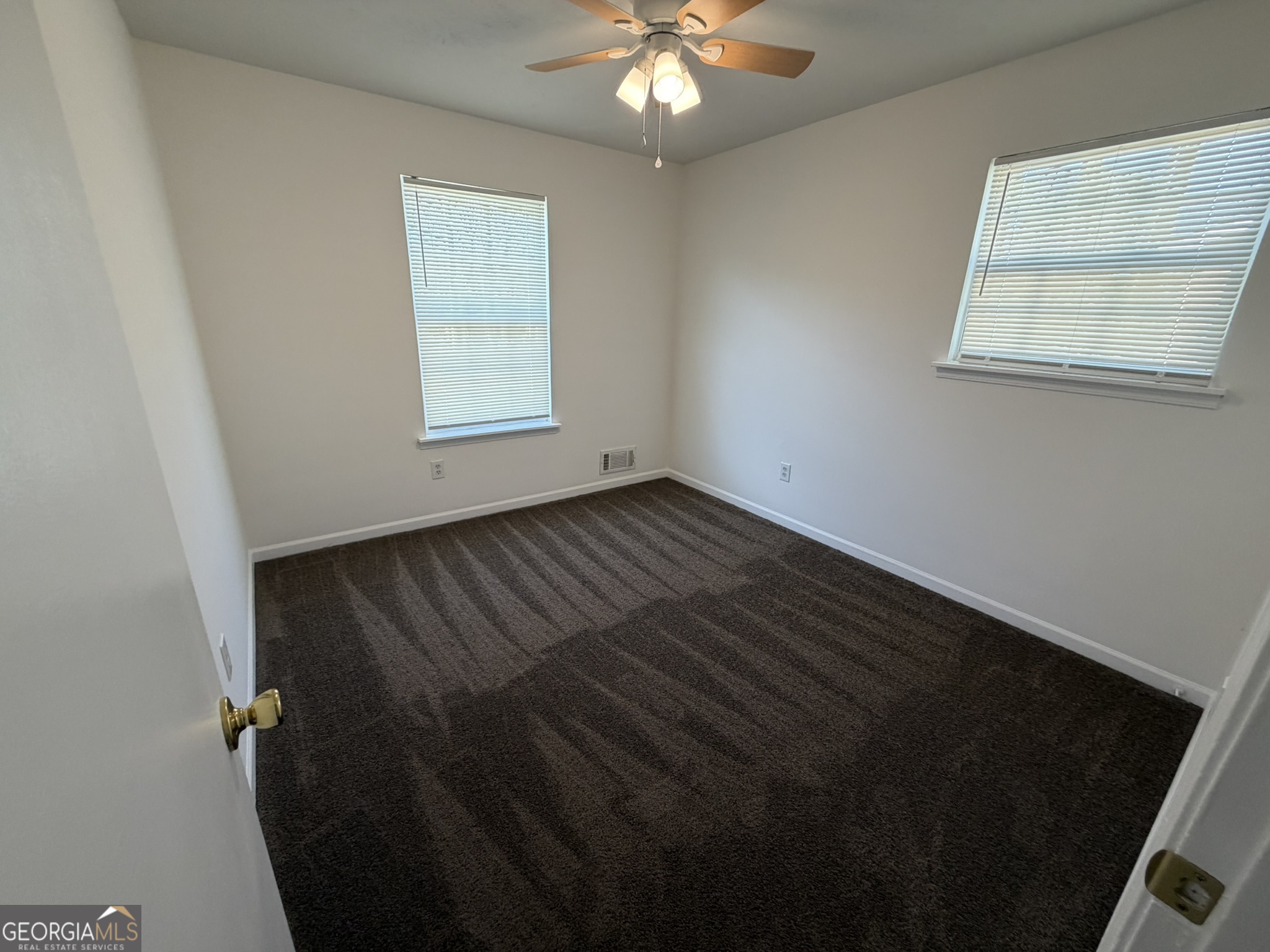 9292 Settlers Grove Road Northeast Covington, GA 30014 - Photo 39 of 110 a view of an empty room with a window