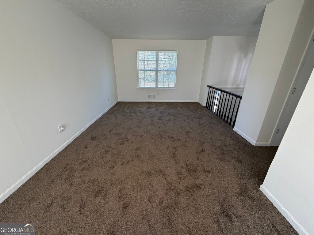 9292 Settlers Grove Road Northeast Covington, GA 30014 - Photo 42 of 110 an empty room with windows