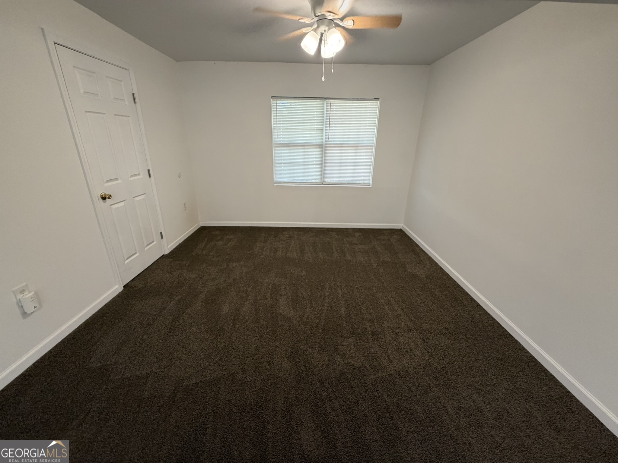 9292 Settlers Grove Road Northeast Covington, GA 30014 - Photo 55 of 110 an empty room with a window
