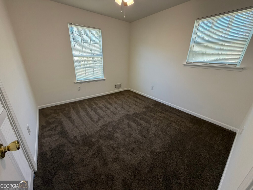 9292 Settlers Grove Road Northeast Covington, GA 30014 - Photo 64 of 110 a view of an empty room with a window