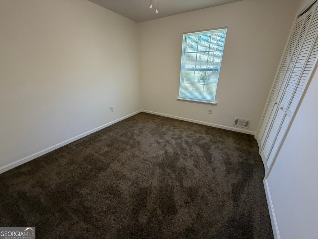 9292 Settlers Grove Road Northeast Covington, GA 30014 - Photo 70 of 110 an empty room with windows