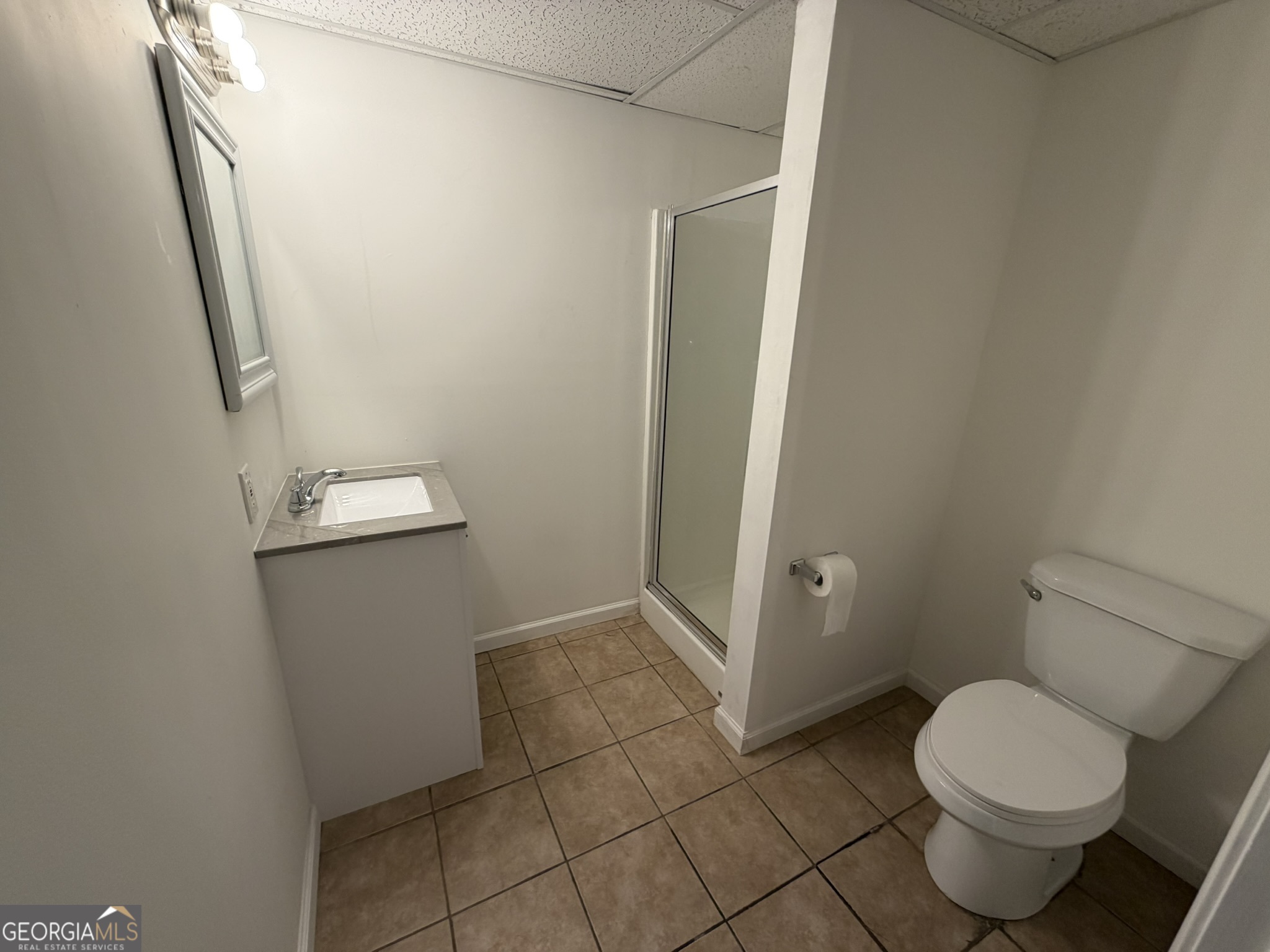 9292 Settlers Grove Road Northeast Covington, GA 30014 - Photo 71 of 110 a bathroom with a toilet and a shower