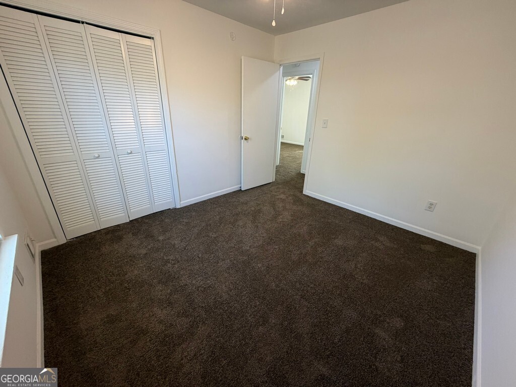 9292 Settlers Grove Road Northeast Covington, GA 30014 - Photo 72 of 110 a view of an empty room