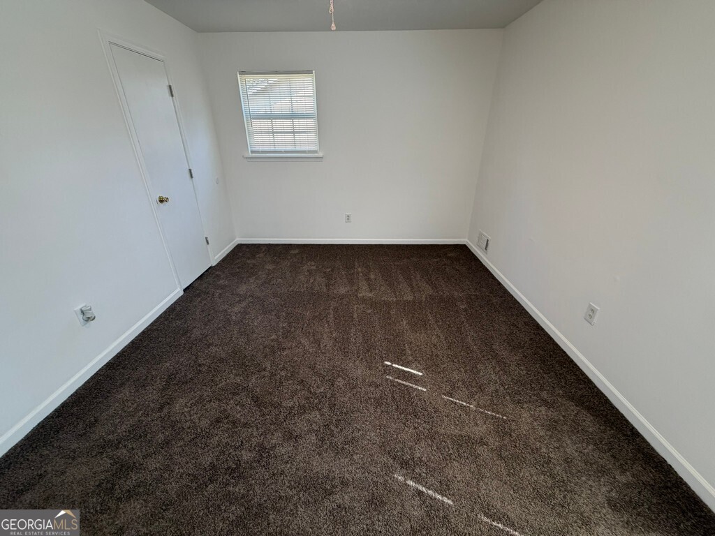 9292 Settlers Grove Road Northeast Covington, GA 30014 - Photo 78 of 110 an empty room with a empty space and window