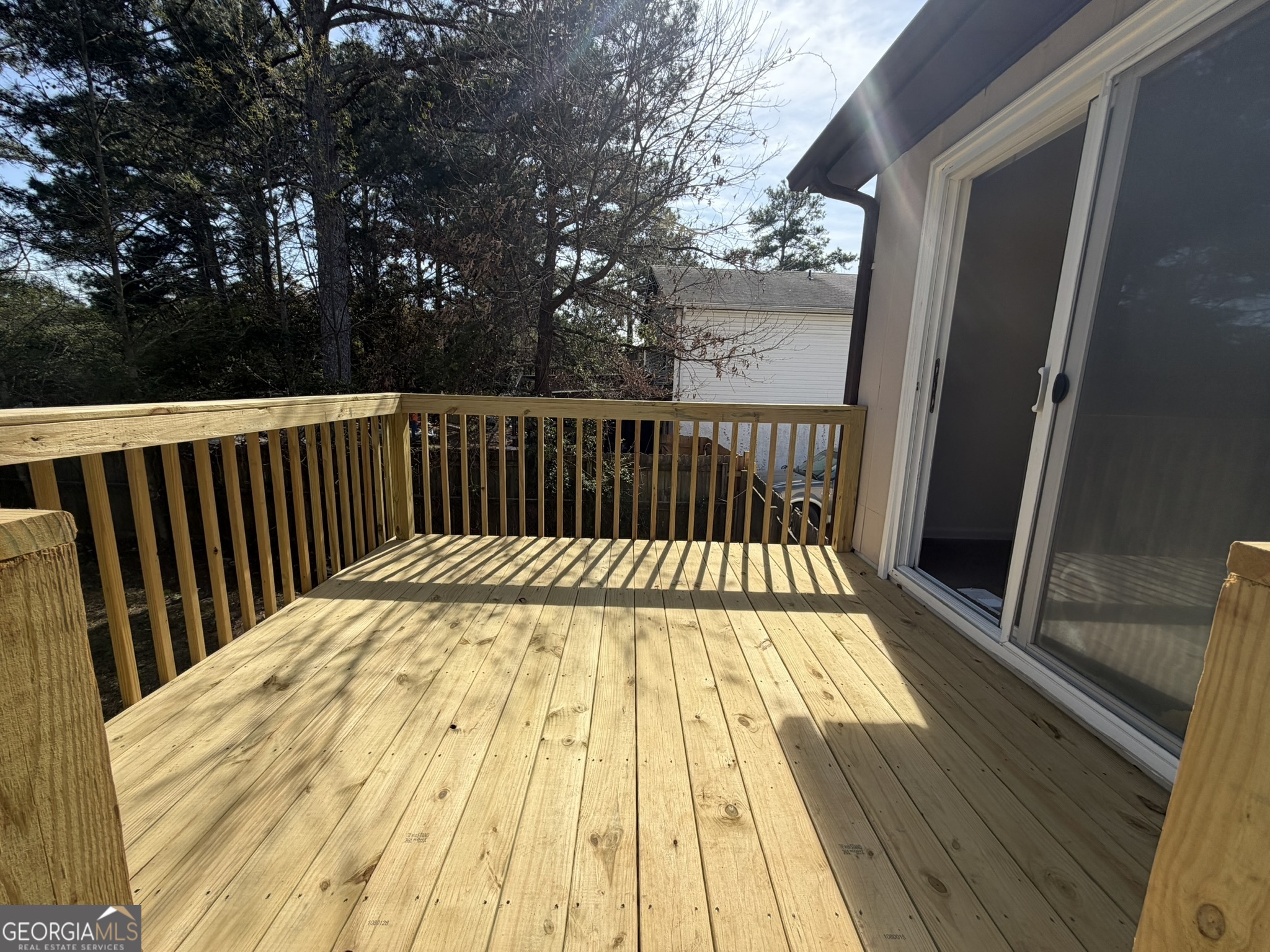 9292 Settlers Grove Road Northeast Covington, GA 30014 - Photo 85 of 110 a view of balcony with wooden floor and fence