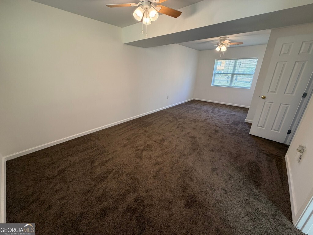 9292 Settlers Grove Road Northeast Covington, GA 30014 - Photo 91 of 110 an empty room with windows