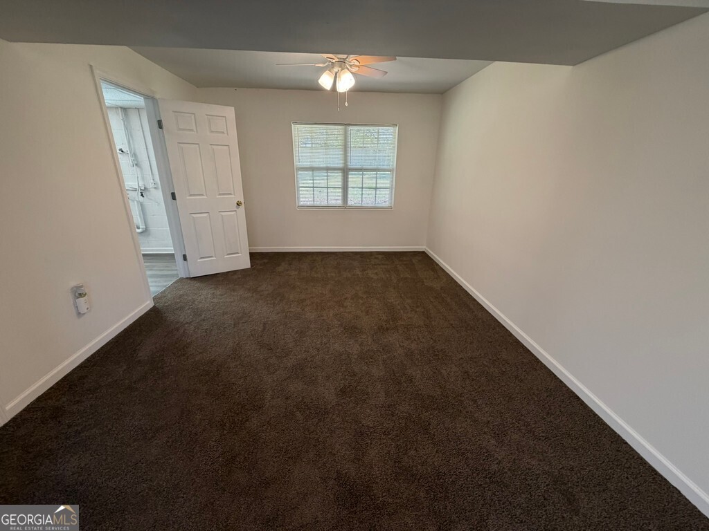 9292 Settlers Grove Road Northeast Covington, GA 30014 - Photo 93 of 110 an empty room with windows