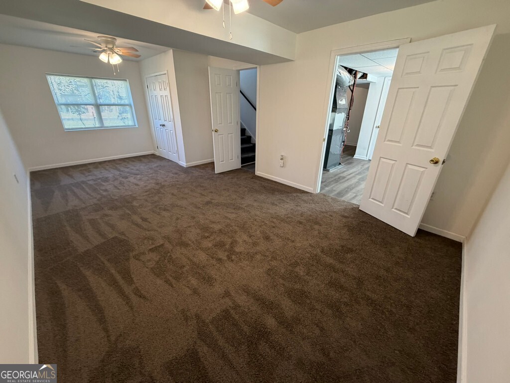 9292 Settlers Grove Road Northeast Covington, GA 30014 - Photo 94 of 110 an empty room with windows and entrance