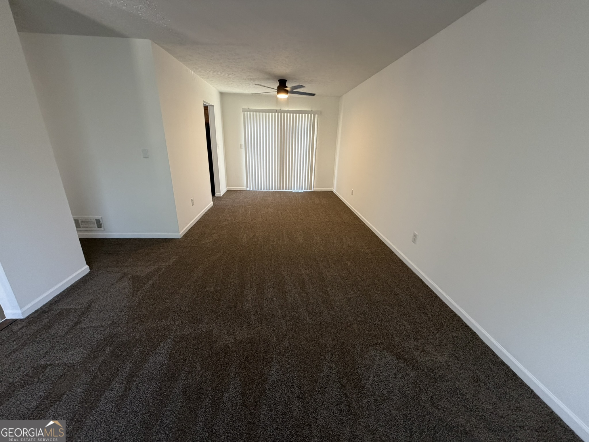 9292 Settlers Grove Road Northeast Covington, GA 30014 - Photo 10 of 110 a view of a big room with closet and windows