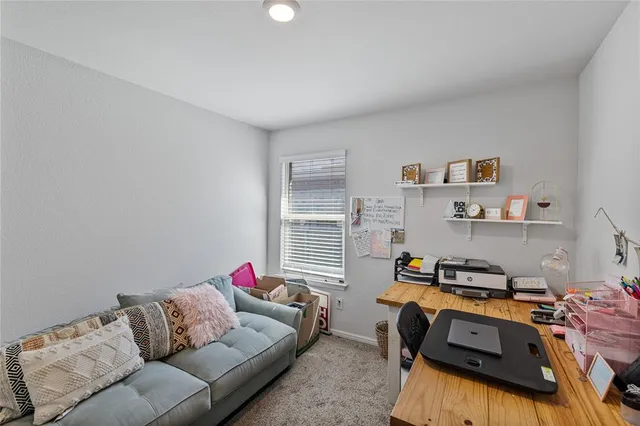a bathroom with a toilet a sink and a shower curtain