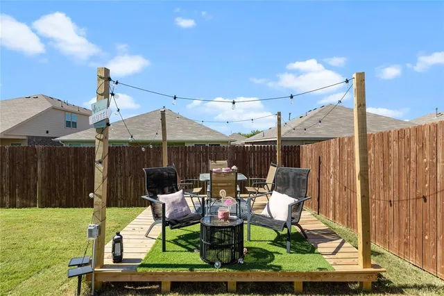 a view of multiple houses with yard