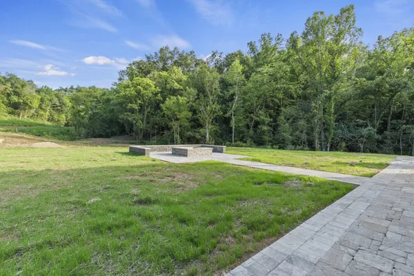 a backyard of a house with large trees