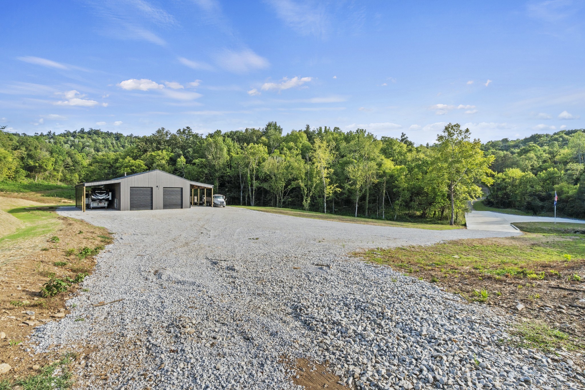 215 Hickman Creek Road South Hickman, TN 38567 - Photo 2 of 98 a house with swimming pool in front of it