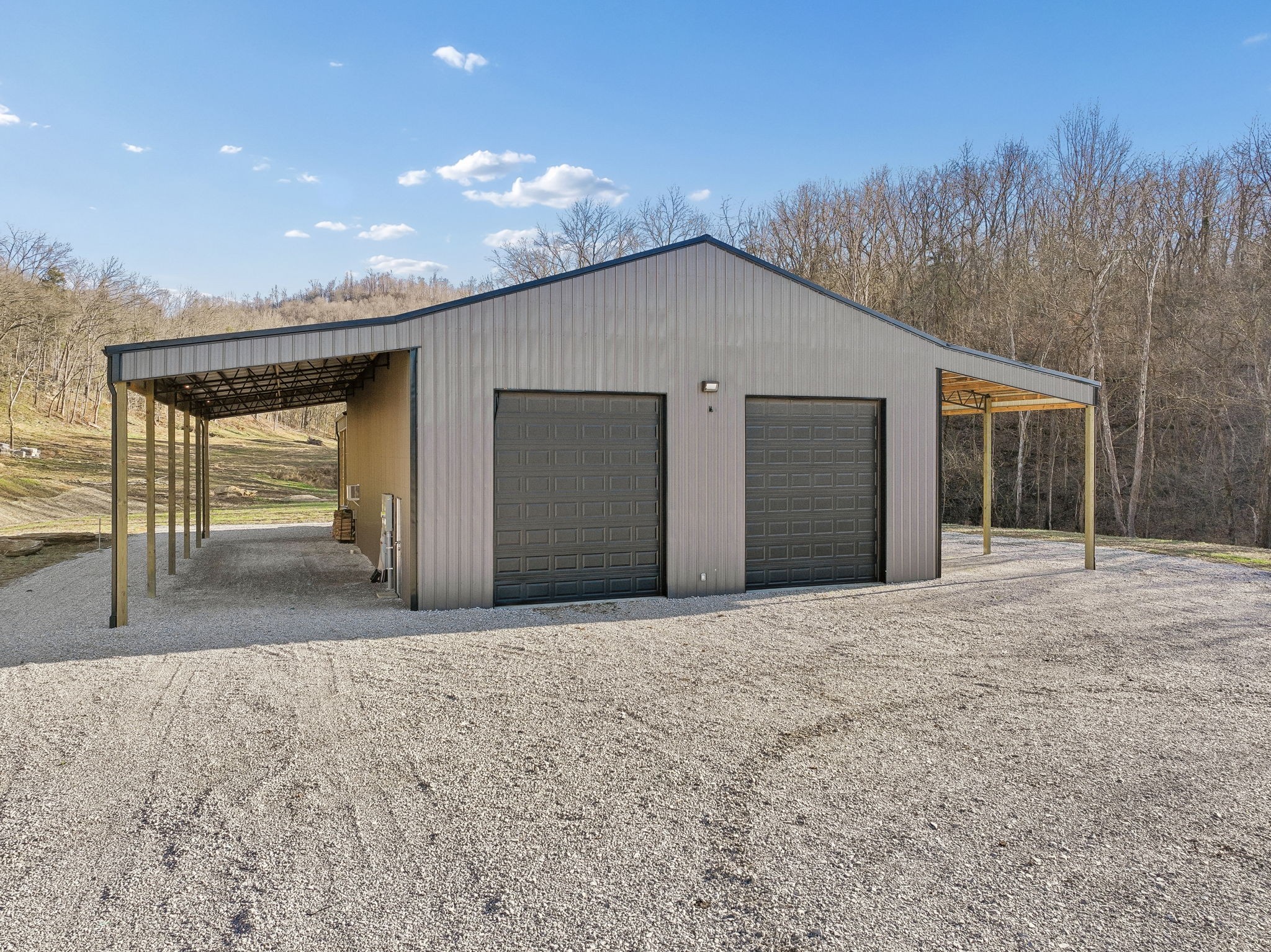 215 Hickman Creek Road South Hickman, TN 38567 - Photo 28 of 98 a view of a house with a backyard and garage