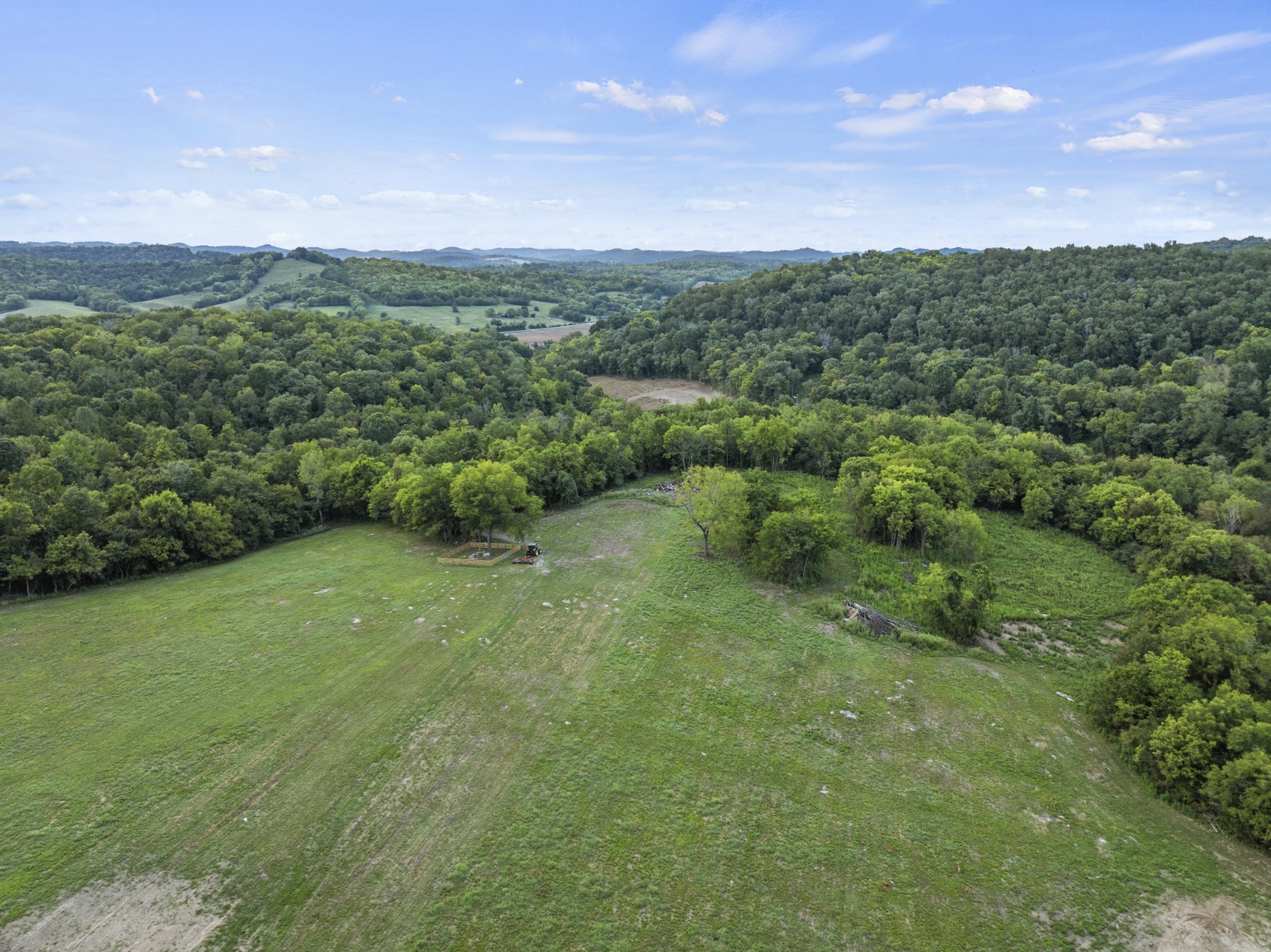 215 Hickman Creek Road South Hickman, TN 38567 - Photo 4 of 98 a view of a green field with mountains in the background