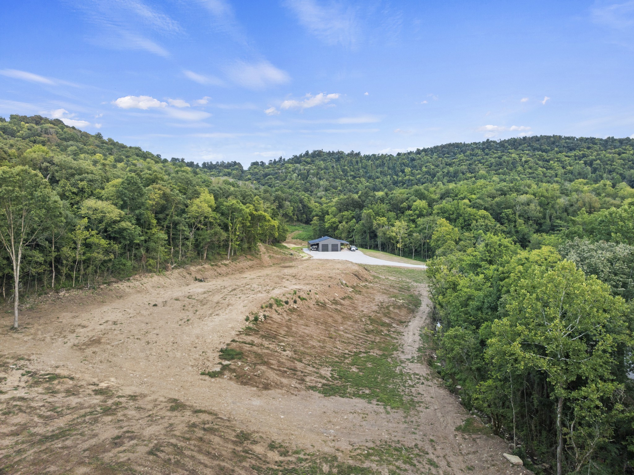 215 Hickman Creek Road South Hickman, TN 38567 - Photo 63 of 98 a view of a field with a trees in the background