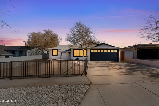 a view of a street with a building in the background