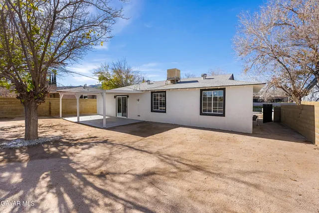 a view of a backyard of a house