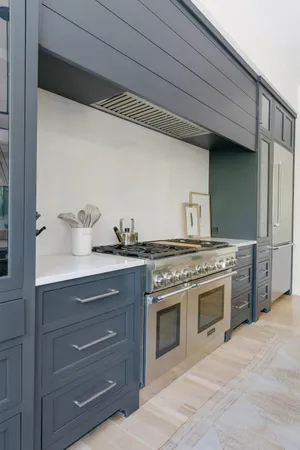 a kitchen with a stove and a sink
