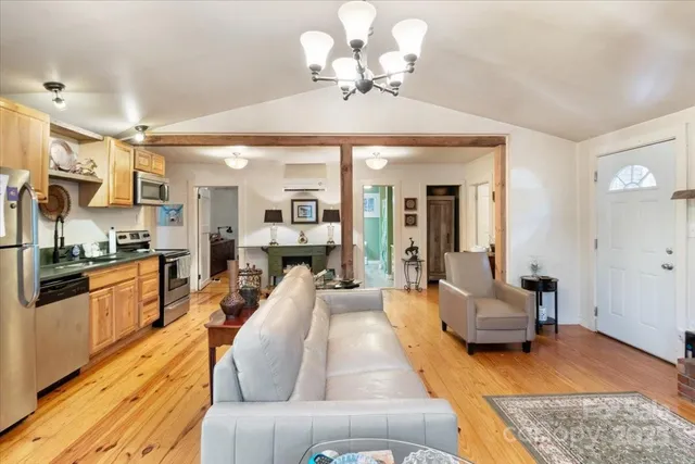 a living room with furniture and a flat screen tv
