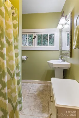 a utility room with sink washing machine and a washer