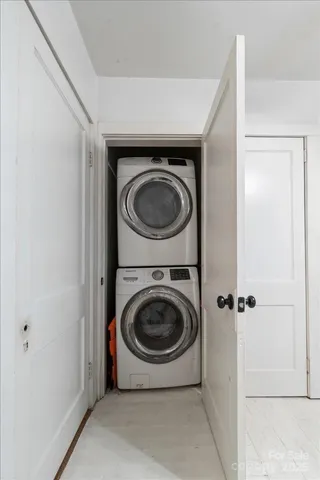 a en suite bathroom with a granite countertop sink and a mirror